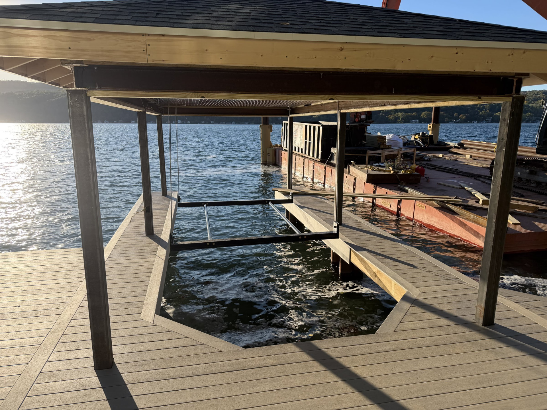 Decking and lift opening under a covered dock
