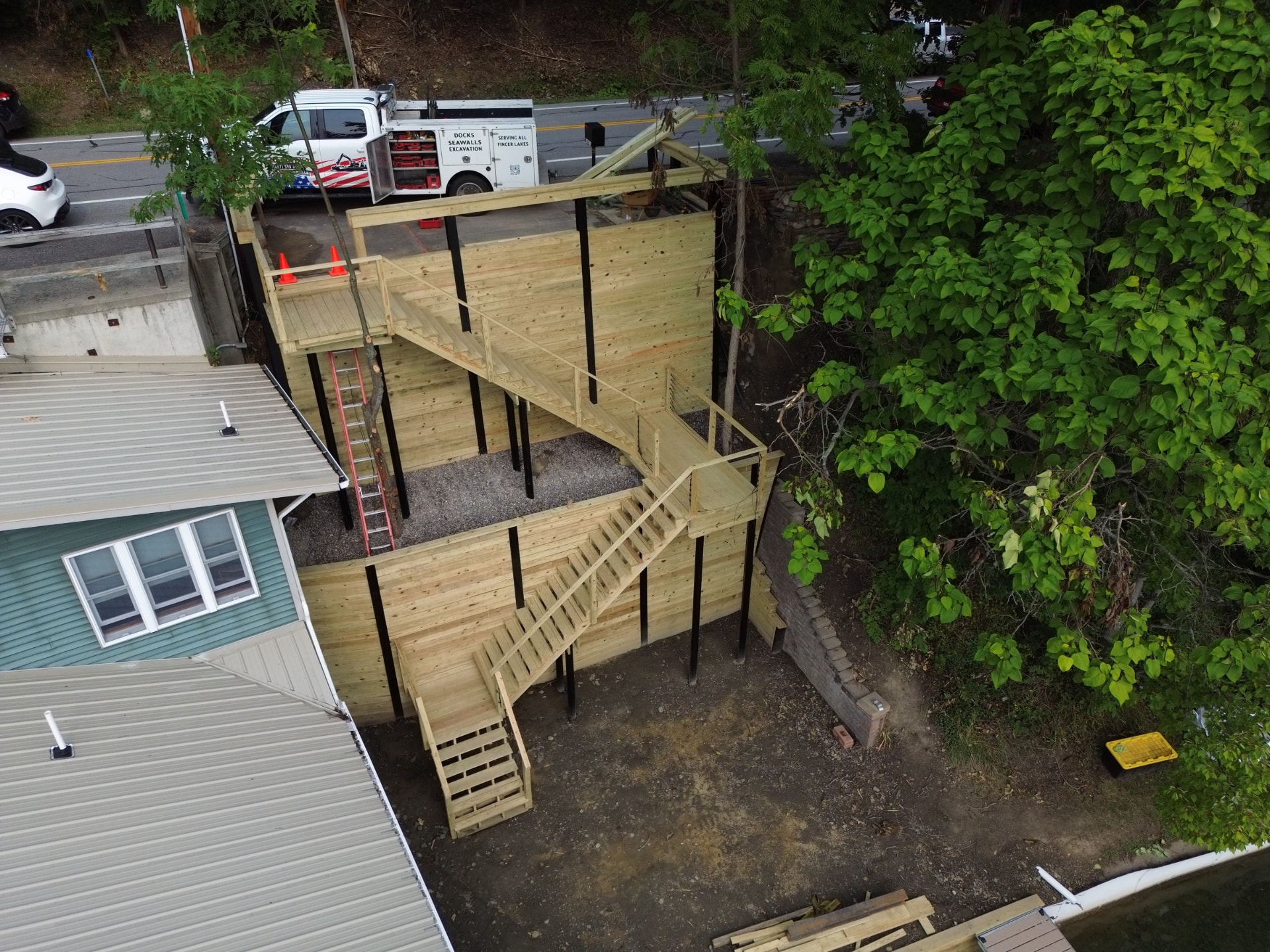 Custom stairs descending toward a waterfront property